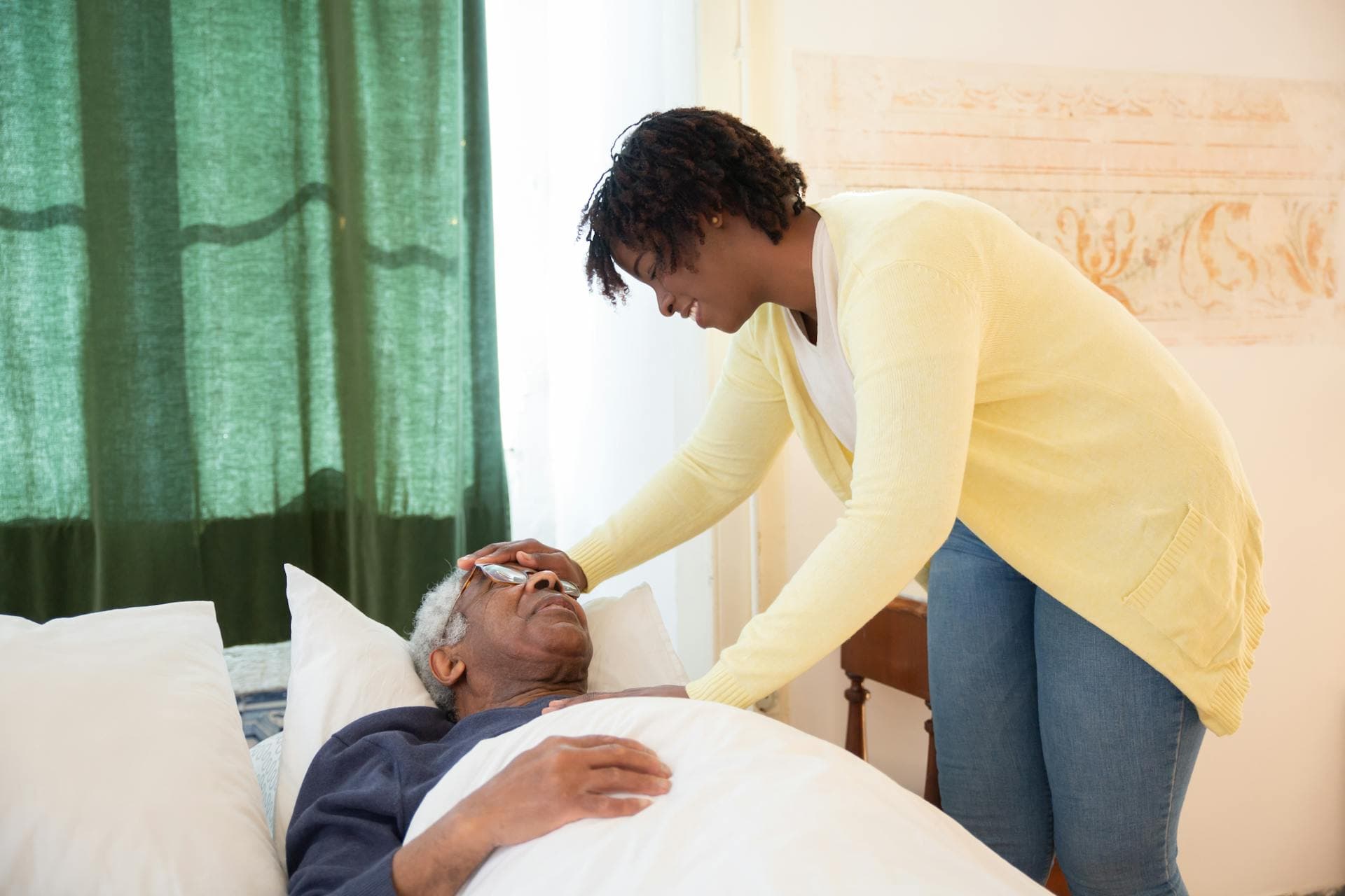 A caregiver tending to a family member at home